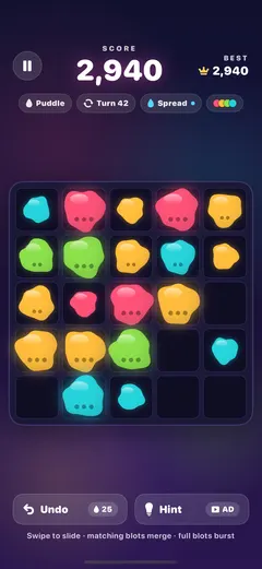 An Inkube game in progress on the five by five Puddle board: glossy pink, amber, green and cyan blots, and a score of 2,940 at turn 42.